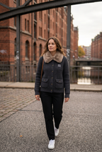 AI-generated lifestyle view of charcoal knit jacket with taupe plush collar