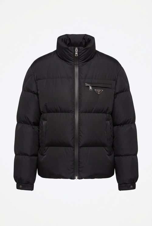 Black quilted puffer jacket, clean studio shot on white background