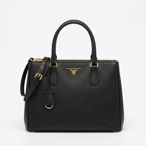 Black saffiano leather tote bag with gold hardware, studio shot on white background