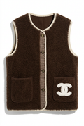 Dark brown textured knit vest with cream crochet trim, studio shot on white background